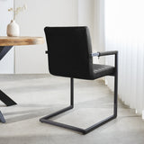 Spisestuestol Kuba Dimehouse Sort LxBxH 71x59x58 Kunstlæder Atmosfærisk foto diagonalt set bagfra