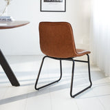 Spisestuestol Mark Dimehouse Cognac LxBxH 74x56x54 Kunstlæder Atmosfærisk foto diagonalt set bagfra